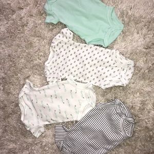 Set of four baby onesies